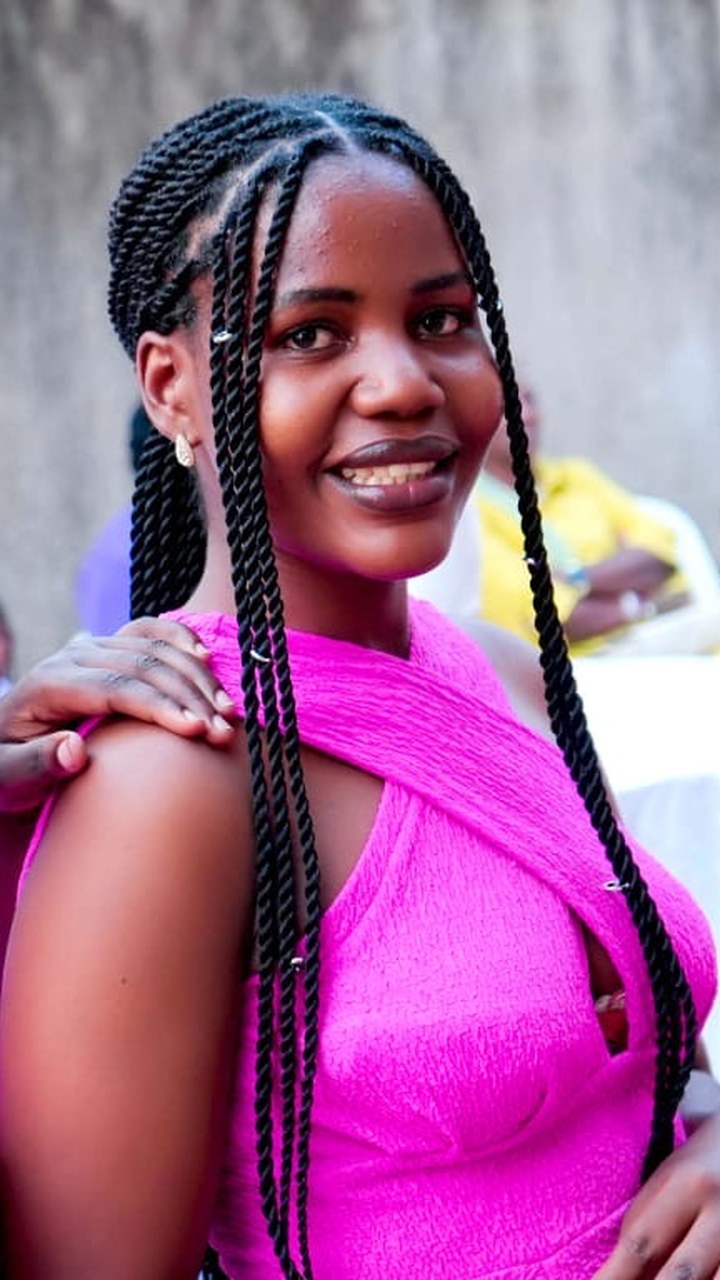 Two Tshani Foundation graduates with fresh braids at a community event